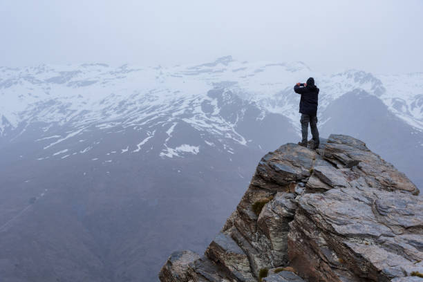 istock Mountaineer on a rocky summit. 1304717325
