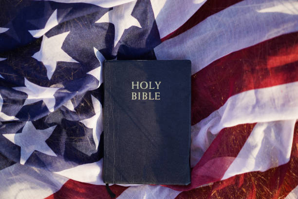 concept image of freedom of religion. god and country. - bible american flag flag old fashioned imagens e fotografias de stock