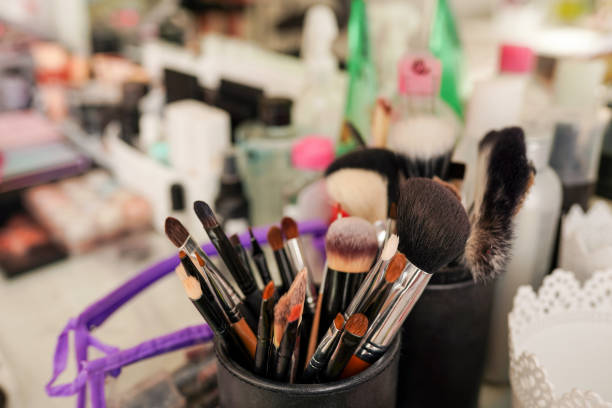 istock Makeup brushes and cosmetics on the table in beauty salon 1304721281