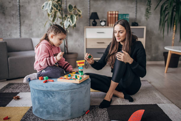 istock Mom and daughter playing together 1304721619