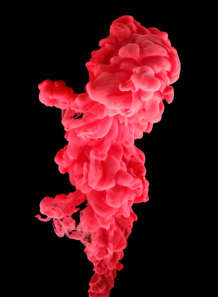 istock Jet of red paint on a black background. 1304721785