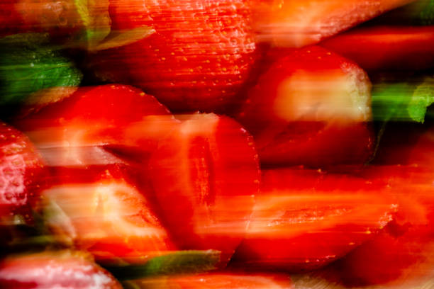 blurry concept photo, appetizing juicy bright strawberries, sprinkled with powdered sugar - vitamin composition