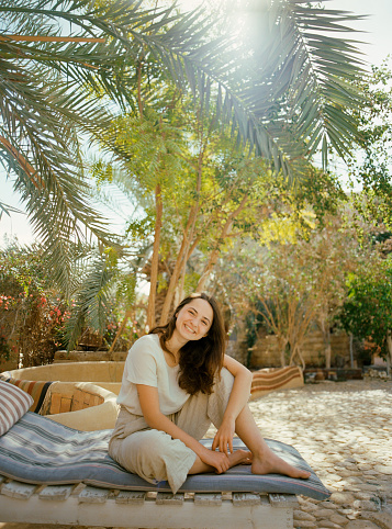 Portrait of young Caucasian  woman in oasis in Egypt