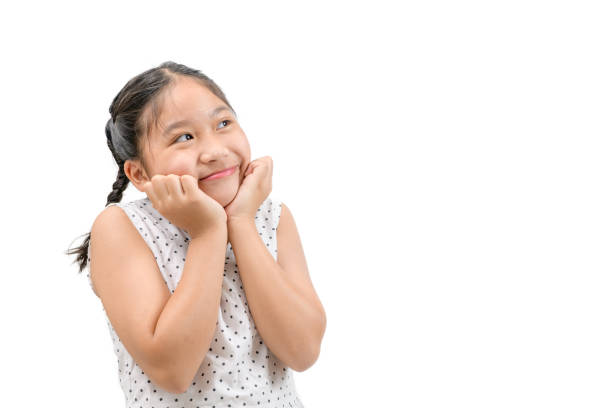 istock Little girl is dreaming or thinking about something isolated 1304723500