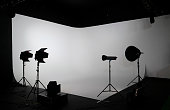 Empty photo studio with photography lighting equipments
