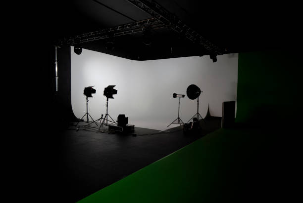 istock Empty photo studio with photography lighting equipments 1304725516