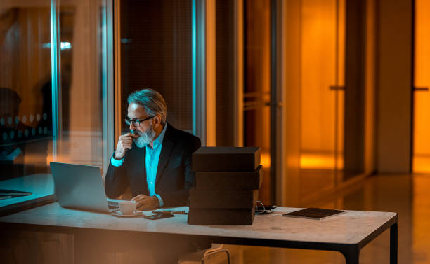 istock Businessman working late in the office 1304725842