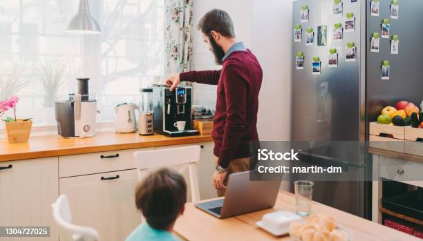 Man Working At Home Making Coffee Using An Espresso Machine Covid19 Home Office Stock Photo - Download Image Now