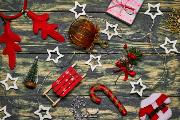 istock Christmas decorations on wooden table. 1304727276