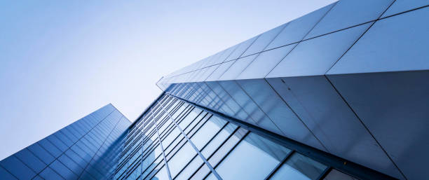 perspective, the skyscraper is directed to the sky. blue gradient, light reflection in glass, urban building design