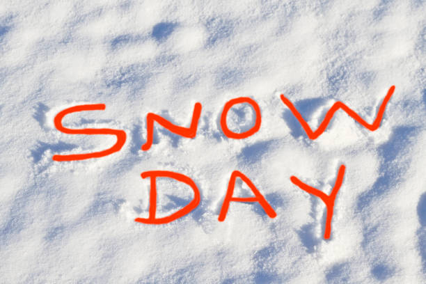 istock SNOW DAY written in red letters in fresh snowfall 1304730084