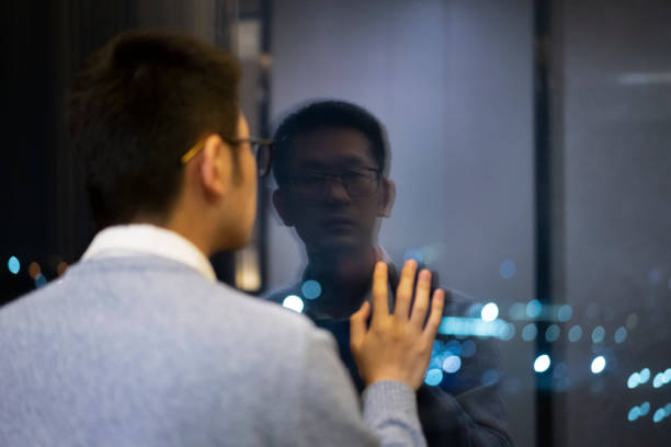 istock Asian man in home quarantine at night 1304730552