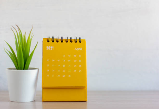 istock Flip calendar for April 2021. Desktop calendar for planning, scheduling, assigning, organizing, managing each date. 1304731020