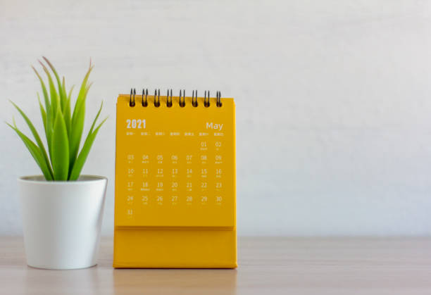 istock Flip calendar for May 2021. Desktop calendar for planning, scheduling, assigning, organizing, managing each date. 1304731531