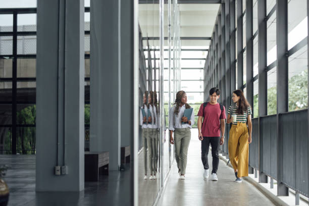 istock Group of Students Walking Together and Chatting on Campus 1304731789