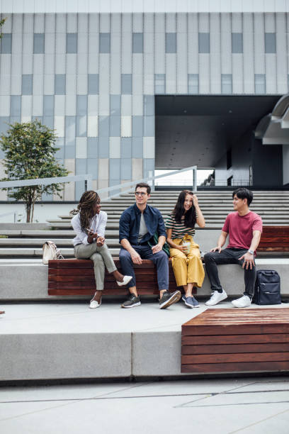 istock University Students Sitting Outdoors 1304731799