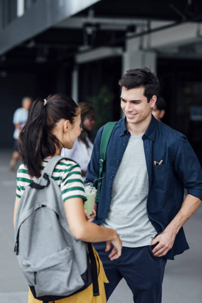 istock Students Chatting in front of a College 1304731827