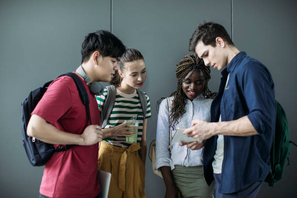 istock Group of Students Looking at Tablet 1304731852