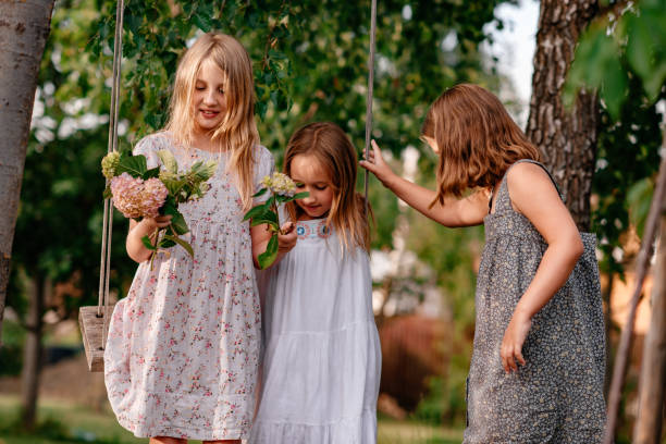 istock Children are resting in the park, riding on a swing. 1304732351