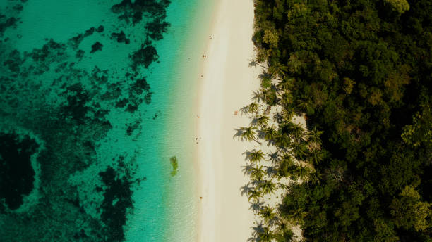 Boracay island with white sandy beach, Philippines Tropical white sand beach, near the blue lagoon and corall reef from above, Boracay, Philippines. Sandy beach with tourists. Summer and travel vacation concept. boracay photos stock pictures, royalty-free photos & images