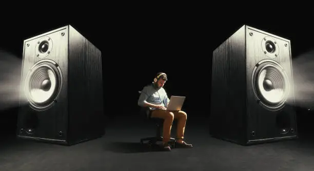 A man broadcasts music through sound speakers. Concept of power sound.