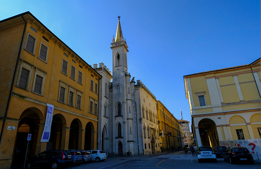 October 2020 Reggio Emilia, Italy: Gallery Parmeggiani across colorful buildings and blue sky.
