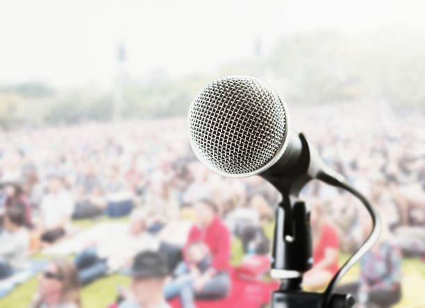 istock Microphone at a big outdoor rock concert 1304734861