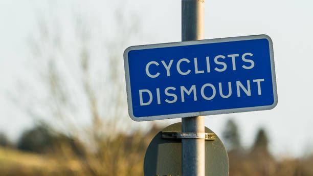 istock Blue Cyclists Dismount sign in a park 1304737212