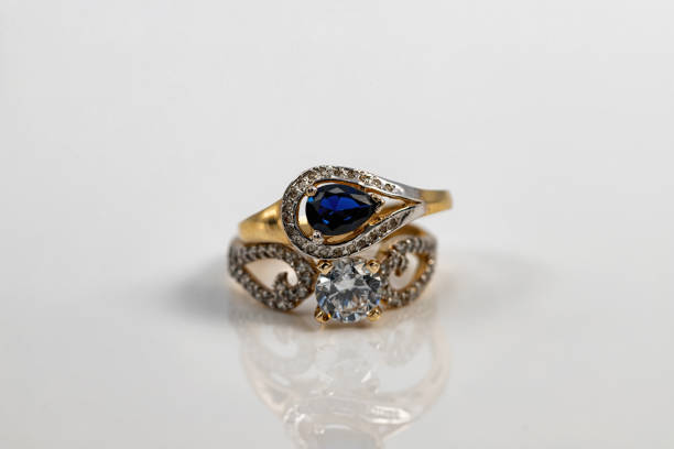 istock Two elegantly shaped gold rings with topaz and diamonds 1304737583