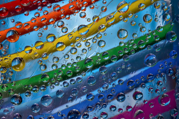 istock Raindrops fall through an open window with rainbow jalousie. 1304738827