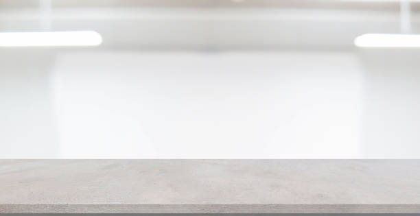 istock abstract blur interior office workplace white background with concrete table for show, promote product and content on display concept 1304739513