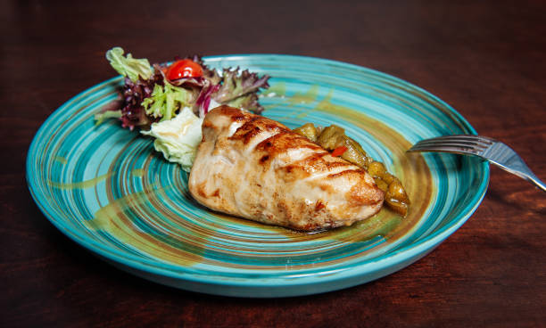 istock Grilled pork meat with pound cucumber and salad 1304740331