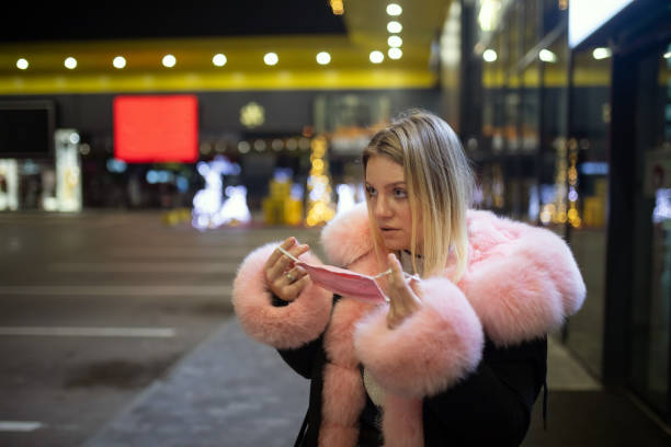istock Putting protection mask on and going for some shopping 1304740591