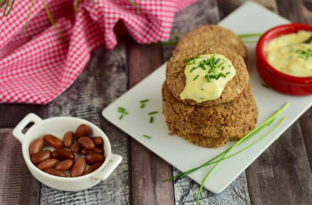 istock Pinto bean patties with mayonnaise mustard dip garnish with chives 1304742802