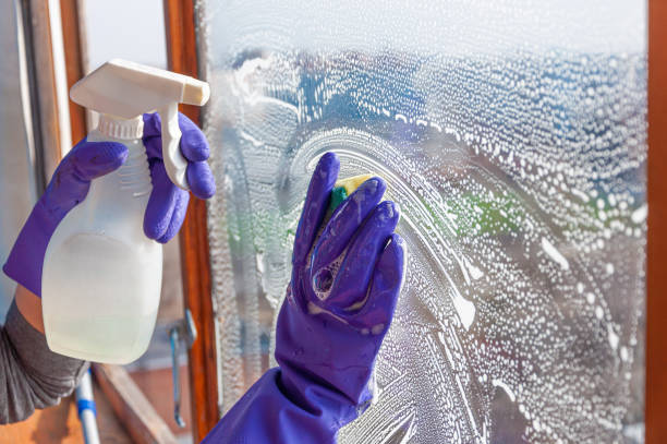 istock The woman washes a dirty window 1304744581