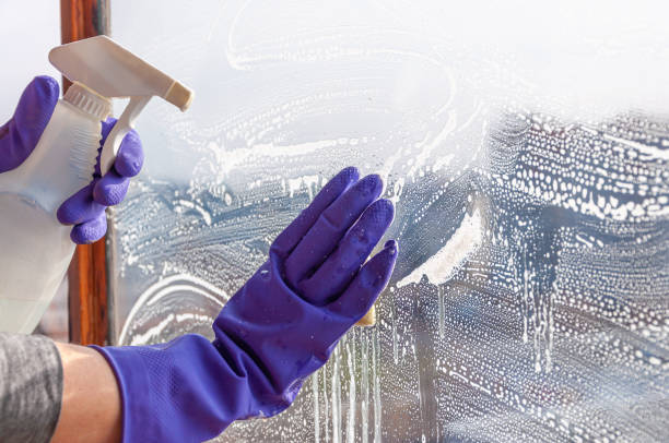 istock The woman washes a dirty window 1304744870