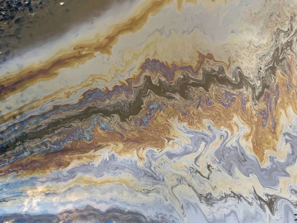 istock Oil spill on asphalt 1304746149