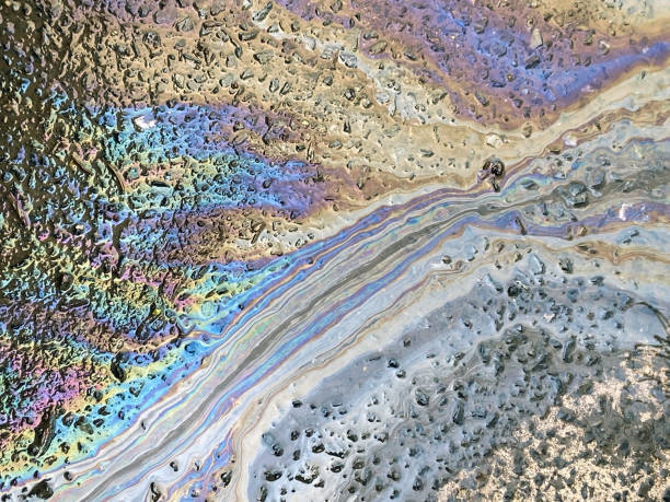 istock Oil spill on asphalt 1304746150