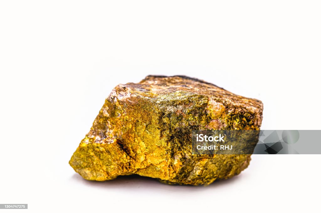 Uranium, a chemical element with a U symbol and an atomic mass equal to 238 u, has an atomic number 92 Uranium, radioactive ore on isolated white background Uranium Stock Photo