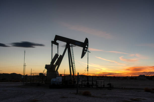 istock Pump Jack Near Carlsbad New Mexico at Sunset 1304747352