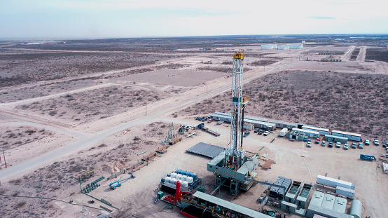 Drone View Of An Oil Or Gas Drill Fracking Rig Pad With an Overcast Sky