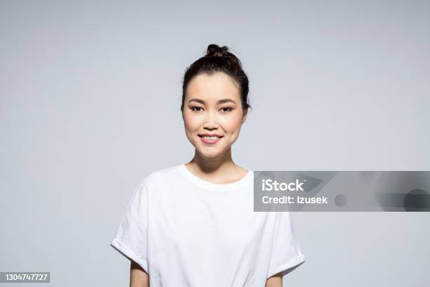Portrait Of Happy Asian Young Woman Stock Photo - Download Image Now - T-Shirt, One Woman Only, Portrait