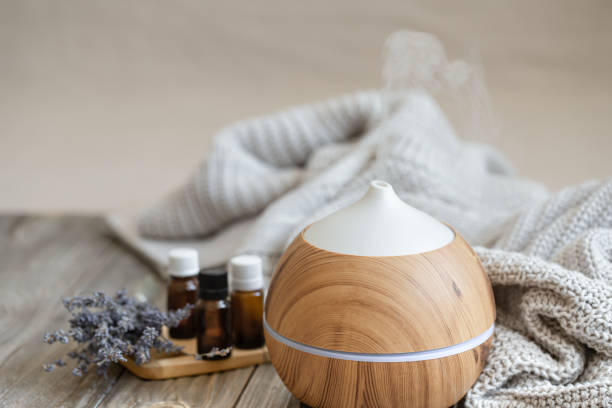 istock Composition with an air humidifier and a set of aromatic oils. 1304747734