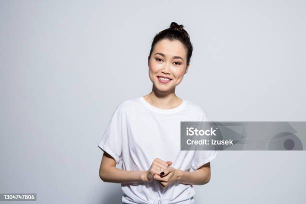 Portrait Of Happy Asian Young Woman Stock Photo - Download Image Now - Women, One Woman Only, Studio Shot