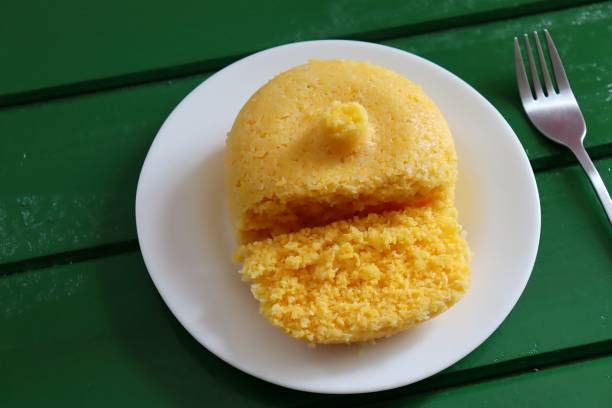 istock Brazilian Couscous (Cuscuz Brasileiro) on green background. Breakfast. 1304750231