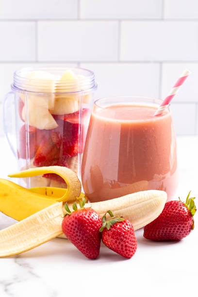 istock A Strawberry Banana Smoothie on a Bright White Kitchen Cabinet 1304754726