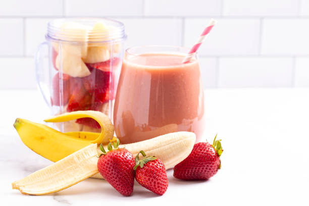 istock A Strawberry Banana Smoothie on a Bright White Kitchen Cabinet 1304754841
