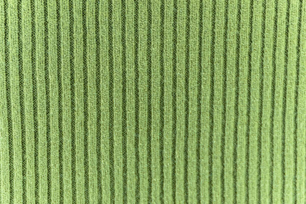 istock Light green knitted fabric texture abstract background 1304755605