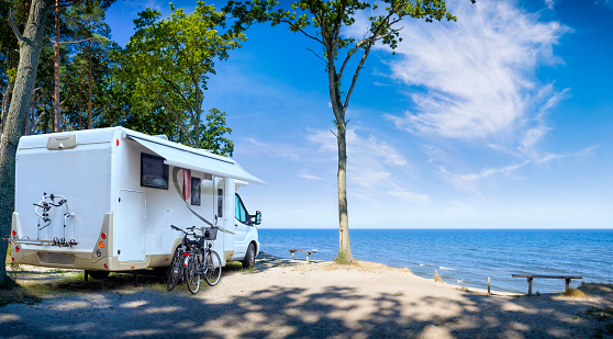 Vacations in Poland - motorhome over a cliff on the Baltic Sea in Rewal, small tourist resort in west pomeranian voivodeship