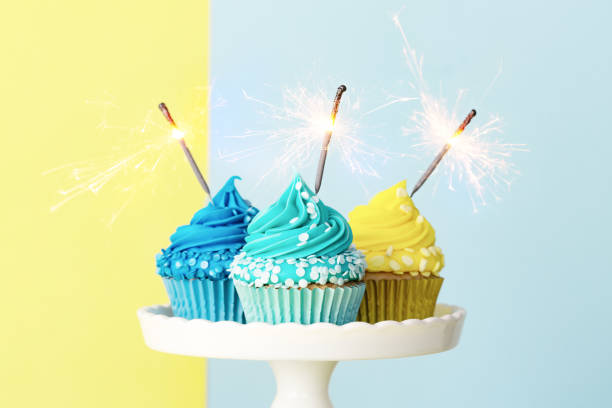 istock Celebration cupcakes in blue and yellow 1304756117